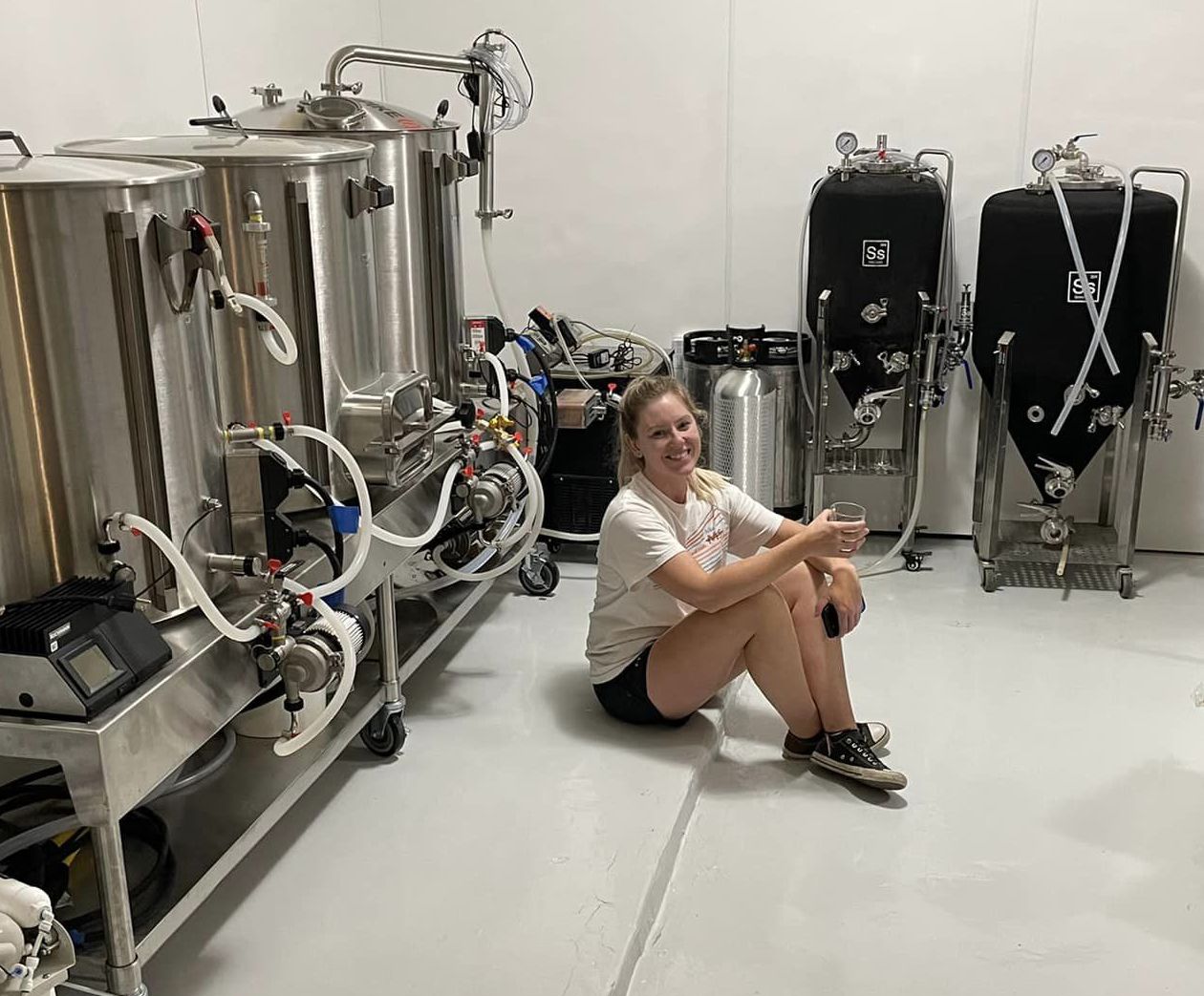 Rebekah sits relieved to have completed building the microbrewery lab in her home