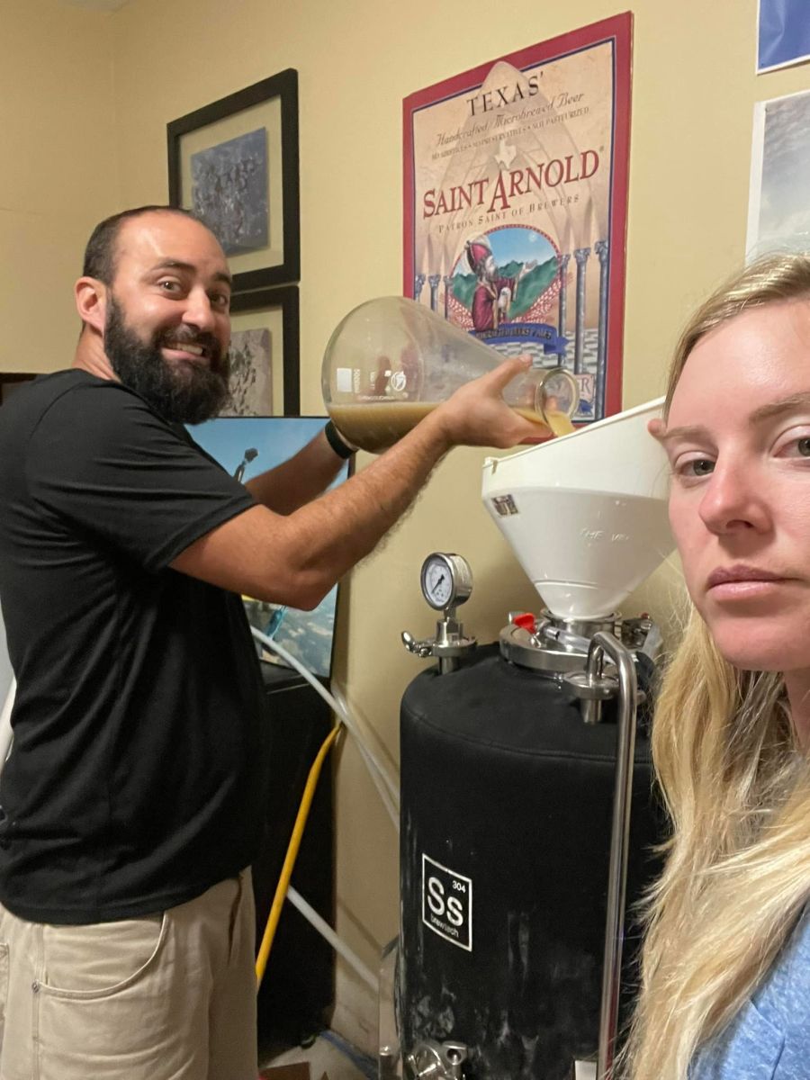 Simon and Rebekah looking pretty gangsta as they transfer wort to a fermentation tank.