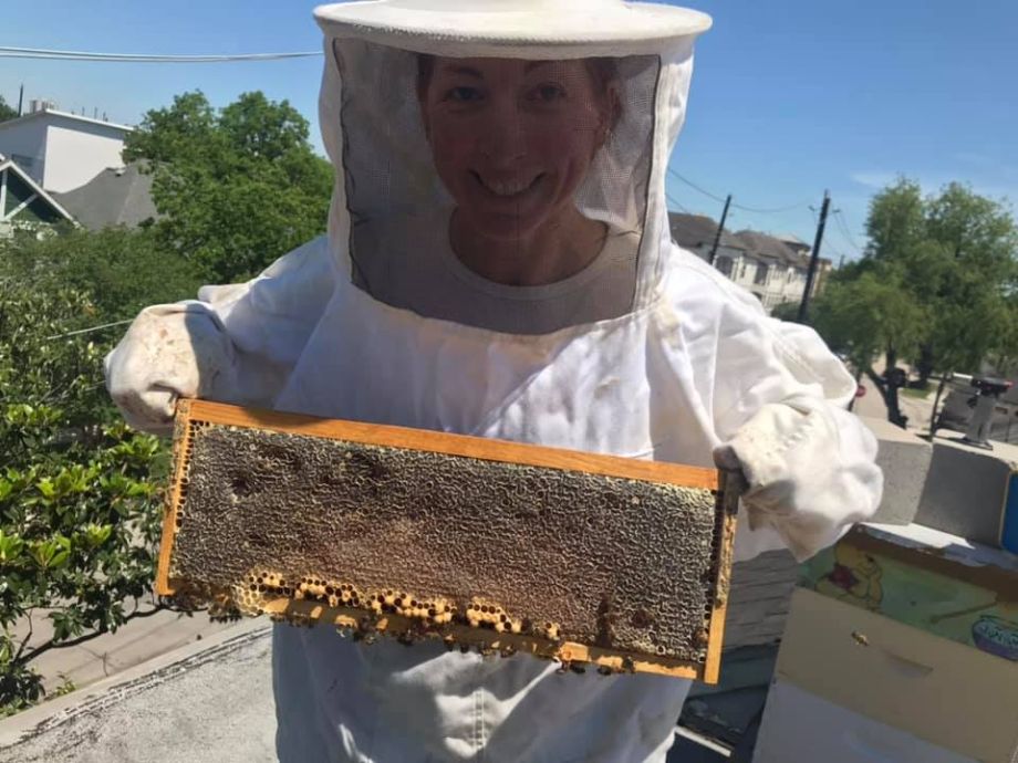 Showing-off a frame stacked with honey